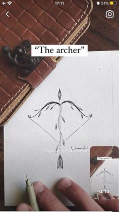 someone is drawing an arrow on paper
