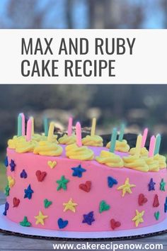 a pink cake with candles on it sitting on top of a table next to a sign that says max and ruby cake recipe