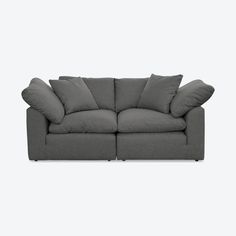 a gray couch with pillows on it