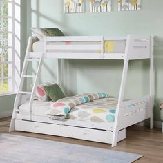 a white bunk bed with drawers underneath it