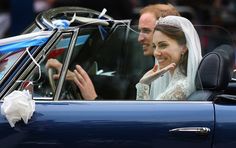 the bride and groom wave from their car as they leave windsor house on their wedding day