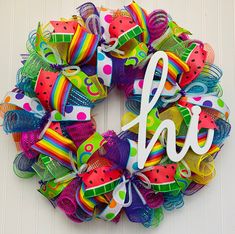 a colorful wreath with the letter h on it