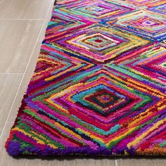 a multicolored area rug on the floor