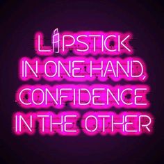 a neon sign that says lipstick in one hand, confience in the other