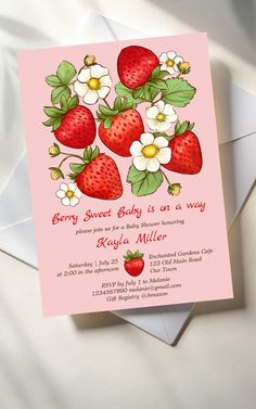 a pink card with strawberries and flowers on it