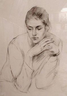 a black and white drawing of a woman with her hands on her chest looking down