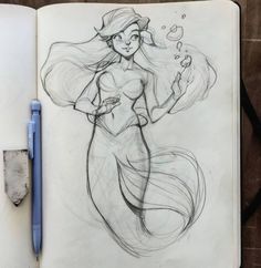 a pencil drawing of a mermaid with bubbles