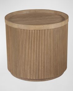 a round wooden table with pleated design