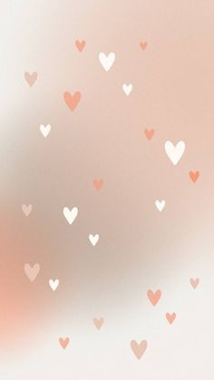 many hearts are flying in the air on a pink and white background that is blurry
