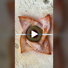 an image of doughnuts with icing and powdered sugar on them being viewed from above