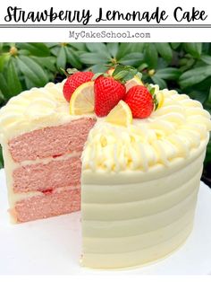 a strawberry lemonade cake with white frosting and fresh strawberries on the top