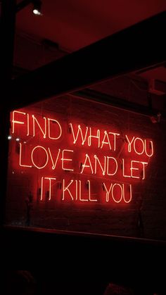 a neon sign that says find what you love and let it kill you on the wall