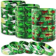 green and red dinosaur pattern washi tapes with various designs on them, all in different sizes