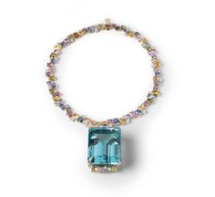 an aqua and multicolored beaded necklace on a white background