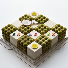 a tennis racket sitting on top of a table covered in balls and cubes