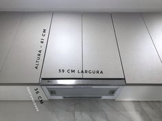 a stainless steel range hood with the name'59 cm laruqua written on it