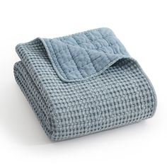 a blue and white checkered blanket on a white background