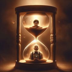 a man sitting in front of an hourglass