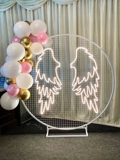 a glass plate with balloons surrounding it and an image of two birds on the front