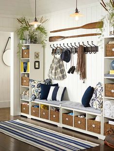 a living room filled with furniture and hanging items