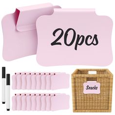 a pink lunch box with 20 pieces of food in it and two straw baskets next to it