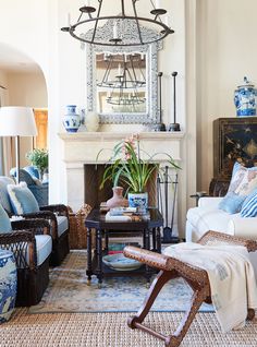 a living room with blue and white furniture