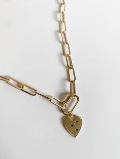 This is the Zoe thick chain paired with the carabiner clasp and a charm. Add any charm from the list to customize it! The image of the model wearing the necklace is a 16 inch chain, but please measure you neck for the best fit. all chains are 14k gold filled Carabiner is vermeil gold