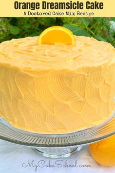 an orange cake on a plate with the words orange dreamsice cake above it