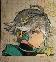 an anime character made out of beads on a piece of paper with words written in it