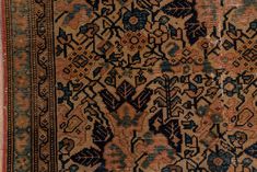 an old rug with blue and brown colors