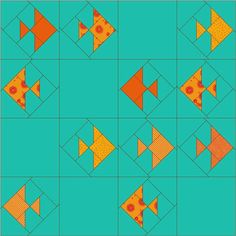 an image of a quilt pattern with orange fish on blue background and yellow dots in the middle