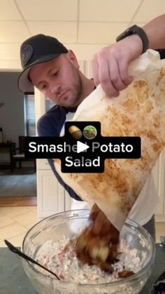 a man pouring something into a bowl filled with food