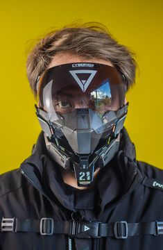 a man wearing a motorcycle helmet and goggles