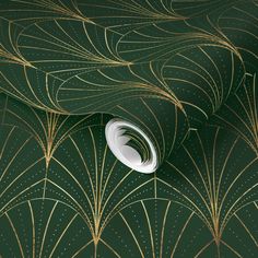 an art deco wallpaper design with gold and green fan pattern on the back ground