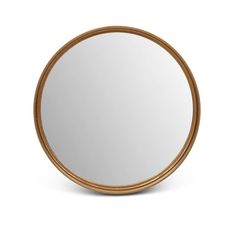 a round wooden mirror sitting on top of a white wall