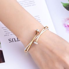 This Cycolinks double crystal Nail bracelet is the perfect piece to add some edge to your look. Specially designed to look like a nail wrapped around your wrist, slap this around your wrist to show off your love for a mechanical mind, so unique and rare to find. ✔️ FREE Worldwide shipping, we ship to over 250 Countries! ✔️ 316L Stainless Steel & cubic zirconium ✔️ Width: 0.6cm ✔️ Weight: 24g ✔️ Length: 17.5cm-18cm. ✔️ PERFECT GIFT – Ideal for friends/loved ones that enjoy all things to do with b Gold Bangles For Women, Nail Bracelet, Latest Bracelets, Diamond Bracelet Design, Modern Gold Jewelry, Gold Bracelet For Women, Bracelets Gold Diamond, Gold Ring Designs, Bangles Jewelry Designs