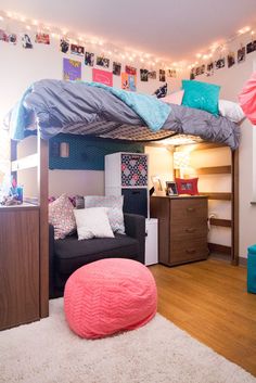 a bedroom with a loft bed and couch in it