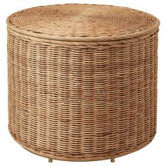 a round wicker basket with lid