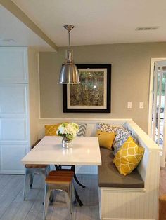 a kitchen table with two benches and a bench in front of the door that leads to an outside patio