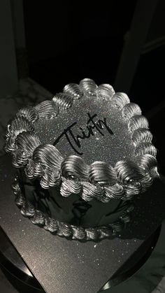 there is a cake that has been decorated with the word tatt on it,