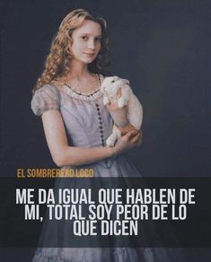 a woman holding a stuffed animal in her hands with the caption'me da igual que hablen de mi, total soy por de lo