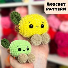 two small crocheted toys are held in the palm of someone's hand