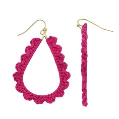 a pair of pink crocheted hoop earrings with gold earwires on a white background