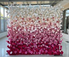 an art installation made out of pink and white flowers