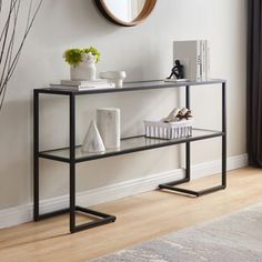 a console table with a mirror on the wall