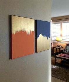 two paintings hanging on the wall next to each other