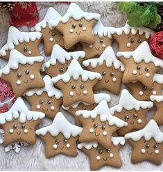 a pile of decorated cookies sitting on top of a table