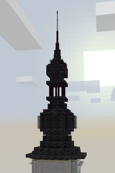 a very tall tower with a clock on it's side and a sky background