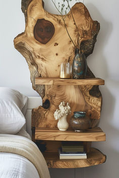 Rustic bedroom with a natural wood sculpted shelving unit beside the bed, epitomizing organic bedside table ideas. Woods Home Decor, Weird Bedside Table, Woods Project Ideas, Bedside Table With Books, Wood Themed Room, Bedside Shelves Ideas, Diy Cozy Bedroom Ideas, Live Edge Bedside Table, Creative Bedside Table Ideas