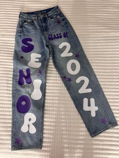 Senior Overalls Designs, Senior Jeans Hoco, Class Of 2024 Painted Jeans, Senior Year Jeans 2024, Jeans For Senior Year, Painted Hoco Overalls, Junior Spirit Week Jeans, School Spirt Pants Ideas, School Spirit Pants Diy